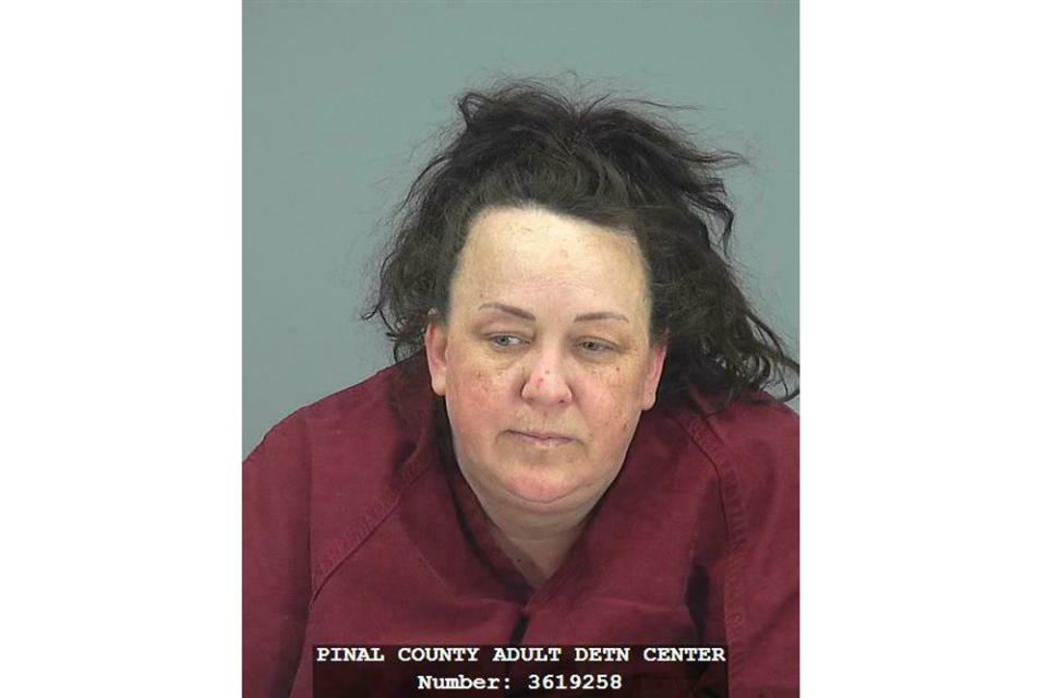 This booking photo provided by Pinal County Sheriff’s Office shows Machelle Hobson. Authorities say, Tuesday, March 19, 2019, Hobson is accused of abusing seven adopted children, including using pepper spray on them and locking them in a closet. Hobson was booked into the Pinal County Jail on suspicion of two counts of molestation of a child, seven counts of child abuse and five counts each of unlawful imprisonment and child neglect. (Pinal County Sheriff’s Office via AP)