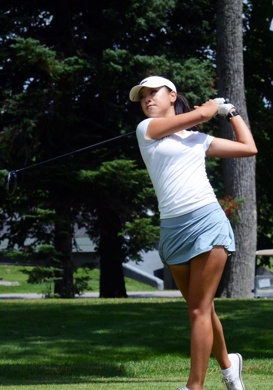 Michelle P. Ding of Toronto keeps tabs on her opening round tee shot during the start of the Coca-Cola Junior Championships Tuesday at The Highlands of Harbor Springs.