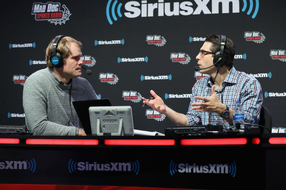Adam Schein, right, chats with Greg Olsen on Super Bowl LIII Radio Row on Feb. 1, 2019, in Atlanta, Georgia. Schein trashed Jordan Love on his TV show last week, claiming the Packers quarterback "can't play football" and that he despises him.