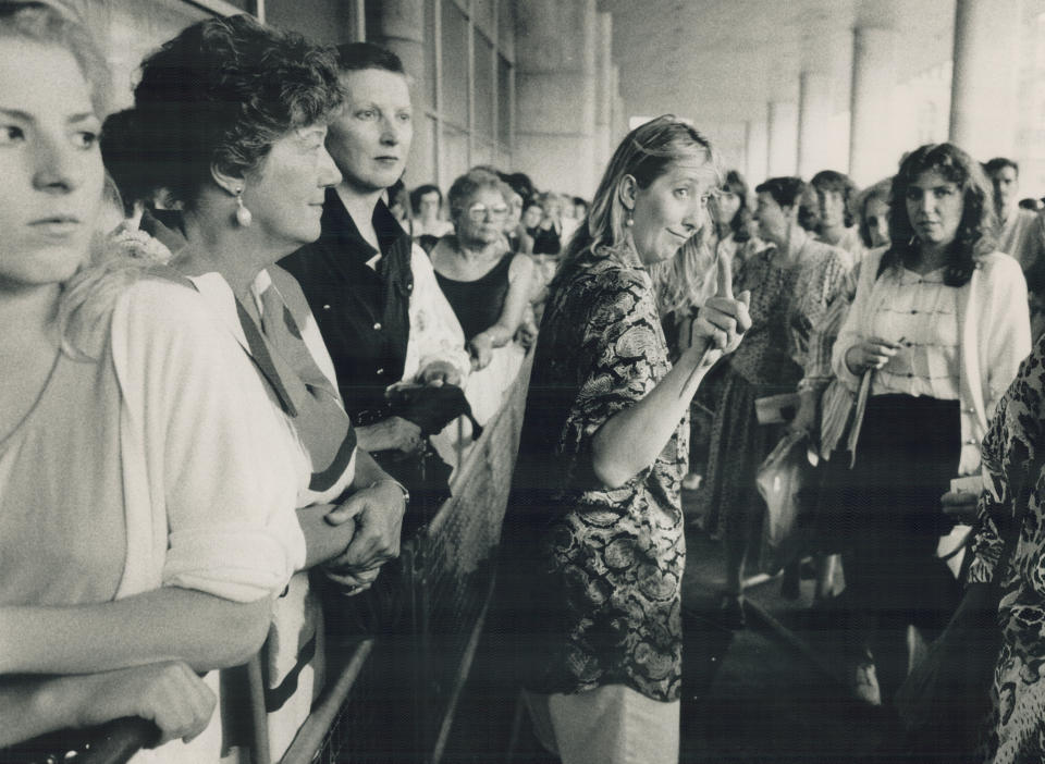 July 25, 1989: Costume co-ordinator Therese Denis helps people who turned out to a casting call for the opera Aida, staged at the SkyDome. Verdi's stage spectacle called for hundreds of extras. (Photo by Tony Bock/Toronto Star via Getty Images)