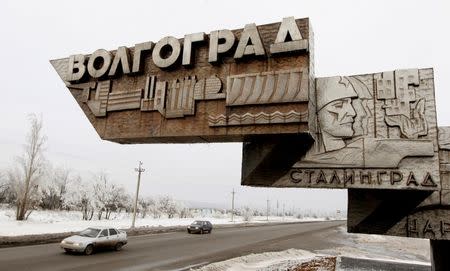 Cars drive past the sign reading "Volgograd. Stalingrad" on the outskirts of Volgograd, Russia, January 1, 2014. REUTERS/Vasily Fedosenko/File Photo