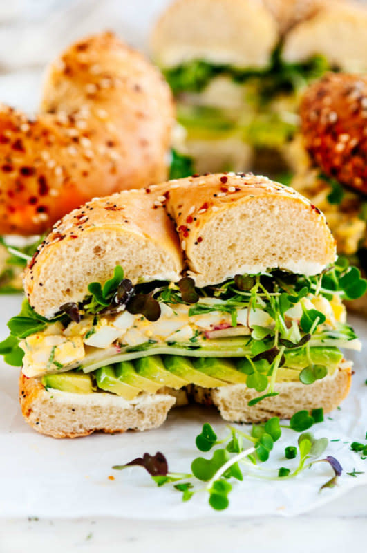 <p>AberdeensKitchen.com</p><p>Classic egg salad dressed up with avocado, cucumber, provolone, radishes, microgreens and cream cheese.</p><p><strong>Get the recipe: <a href="https://www.aberdeenskitchen.com/2019/05/avocado-egg-salad-bagel-sandwich/" rel="nofollow noopener" target="_blank" data-ylk="slk:Avocado Egg Salad Bagel Sandwich;elm:context_link;itc:0;sec:content-canvas" class="link ">Avocado Egg Salad Bagel Sandwich</a></strong></p>