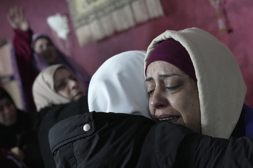 A relative mourns Palestinian Nader Rayan, 16, who was killed by Israeli forces during a raid at Balata refugee camp during his funeral in the Balata refugee camp near the West Bank city of Nablus, Tuesday, March 15, 2022. (AP Photo/Majdi Mohammed)