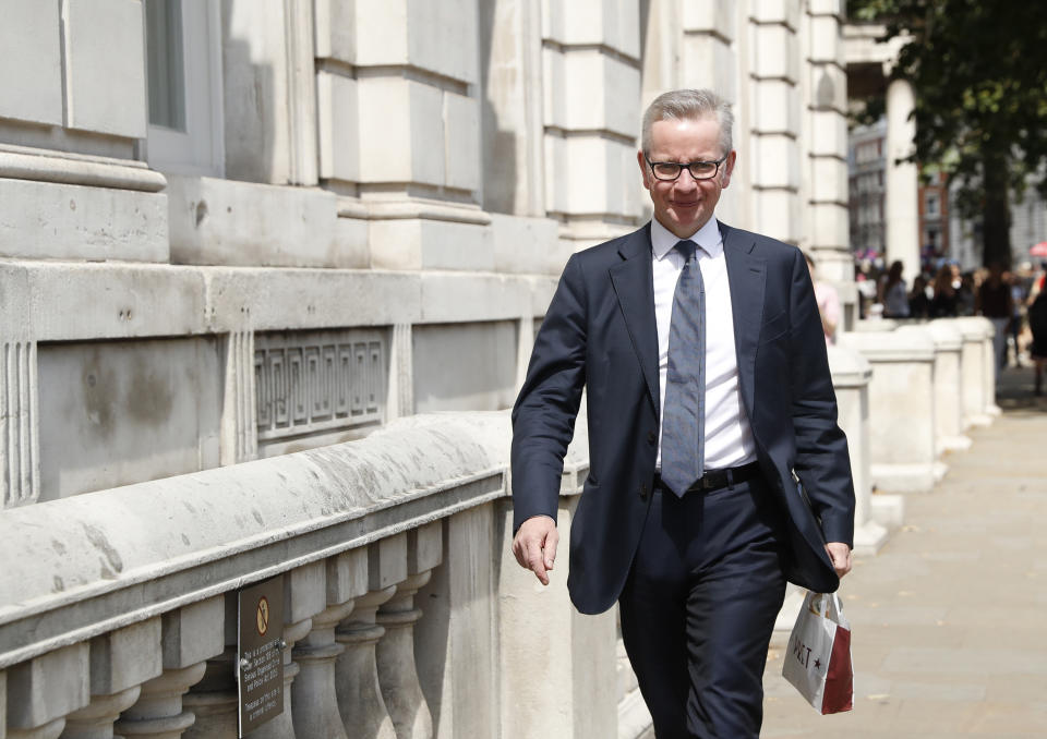 Government minister Michael Gove the Chancellor of the Duchy of Lancaster arrives at his office in Whitehall, London, Monday, July 29, 2019. The first meeting of the Exit Strategy committee to manage Britain's Brexit from Europe, is expected to be chaired by Michael Gove Monday. (AP Photo/Alastair Grant)