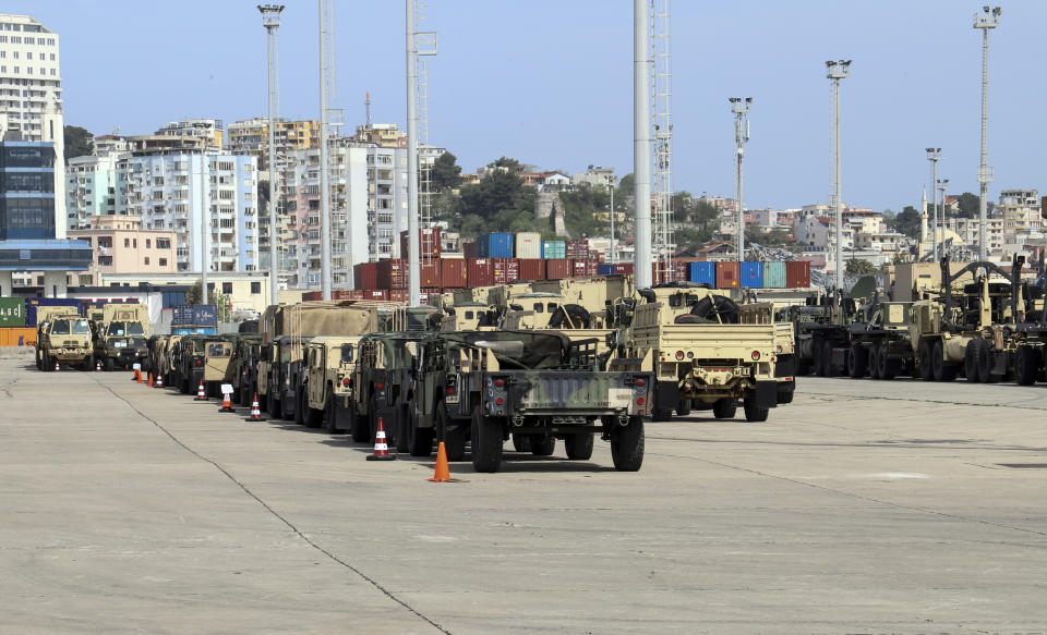 U.S. military vehicles are parked at an area of Albania's main port of Durres, Saturday, May 1, 2021. Florida National Guard's 53rd Infantry Brigade Combat Team were being discharged from the USNS Bob Hope ahead of a two-week training of up to 6,000 U.S. troops in six Albanian military bases, as part of the Defender-Europe 21 large-scale U.S. Army-led exercise. (AP Photo/Hektor Pustina)