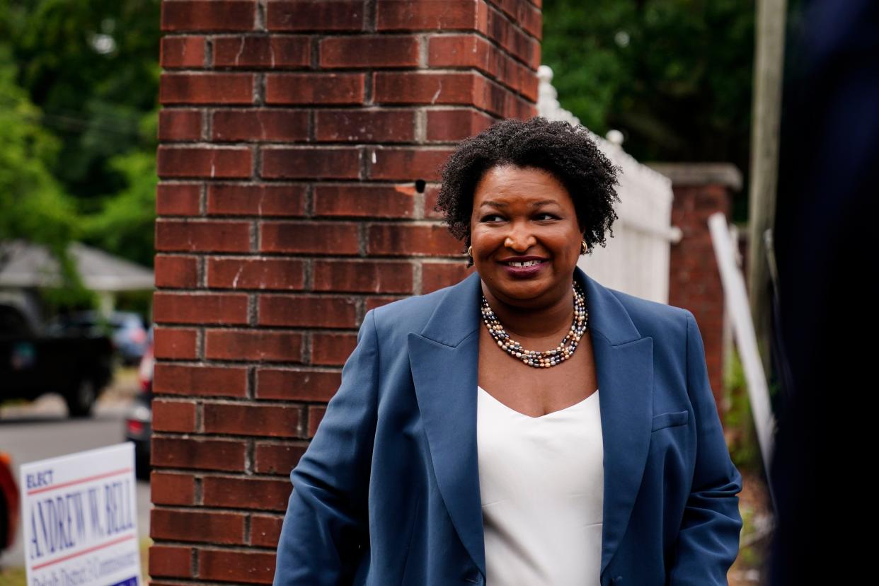 Georgia Democratic gubernatorial candidate Stacey Abrams leaves after talking to the media during the Georgia's Primary election on Tuesday, May 24, 2022, in Atlanta. 