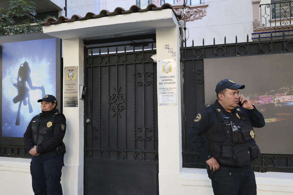 Mexican police stand guard outside the Ecuadorian Embassy, in Mexico City, Saturday, April 6, 2024. The Mexican president moved to break off diplomatic ties with Ecuador after police broke into the Mexican Embassy in Quito to arrest a former vice president who had sought political asylum there after being indicted on corruption charges. (AP Photo/Ginnette Riquelme)