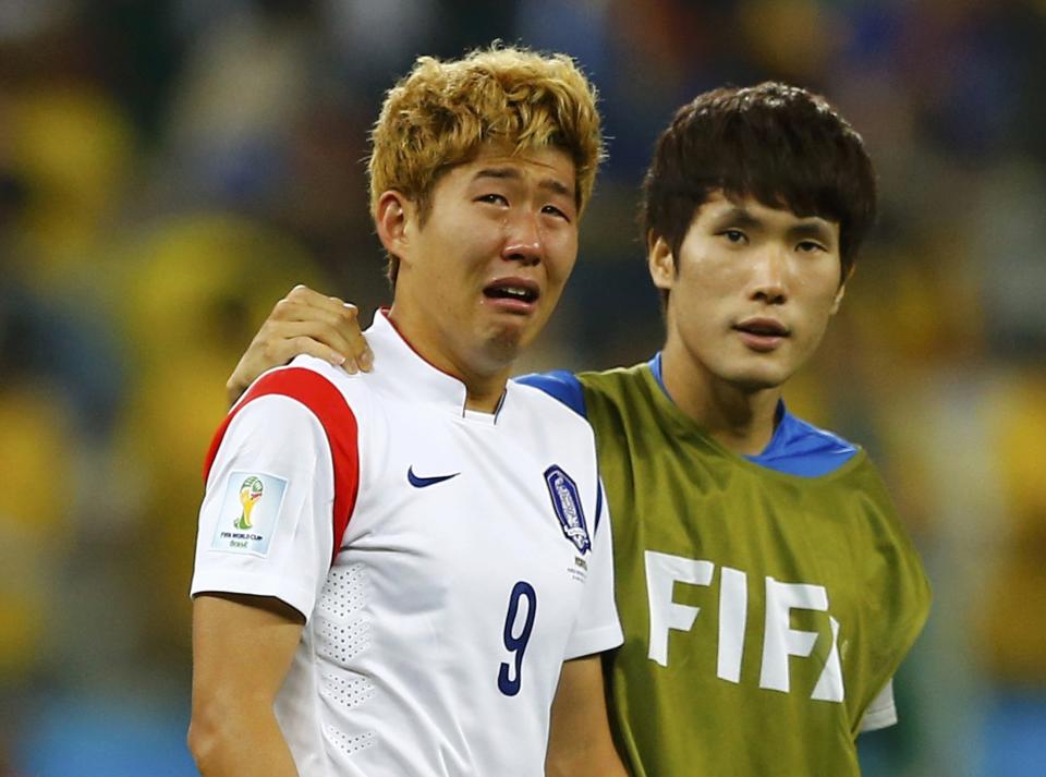 South Korea's Son Heung-min cries after the 2014 World Cup Group H soccer match between Belgium and South Korea at the Corinthians arena