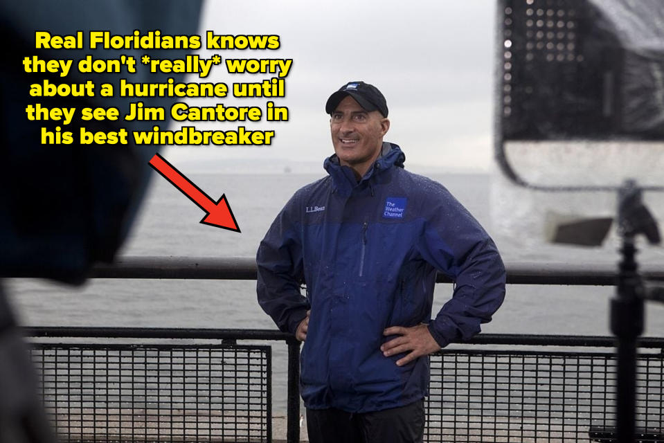 a local news person in a windbreaker trying to cover the hurricane