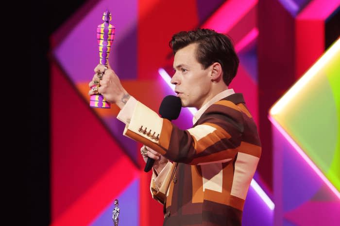 Harry Styles accepts an award onstage at the BRIT Awards in 2021