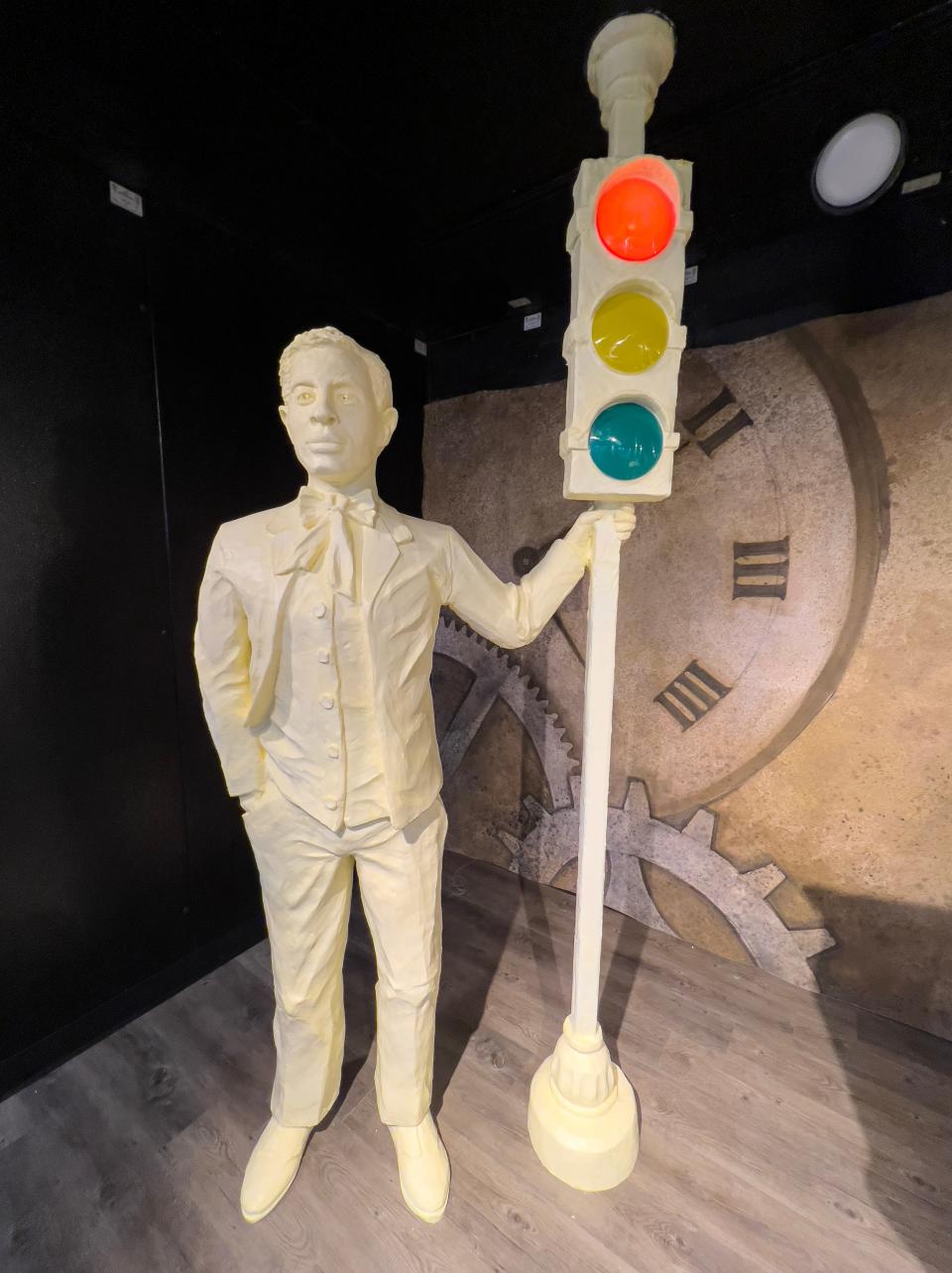 Sculptors used electricity in the butter sculpture of Garrett Morgan and his invention, the three-position traffic signal.