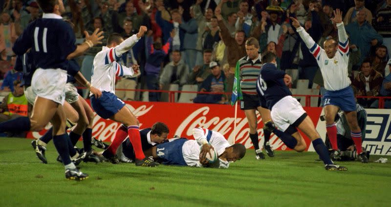 FILE PHOTO: France's Emile Ntamack scores a last-minute, game-winning try against Scotland during their Rugby World Cup clash at Loftus Versfeld, Pretoria.