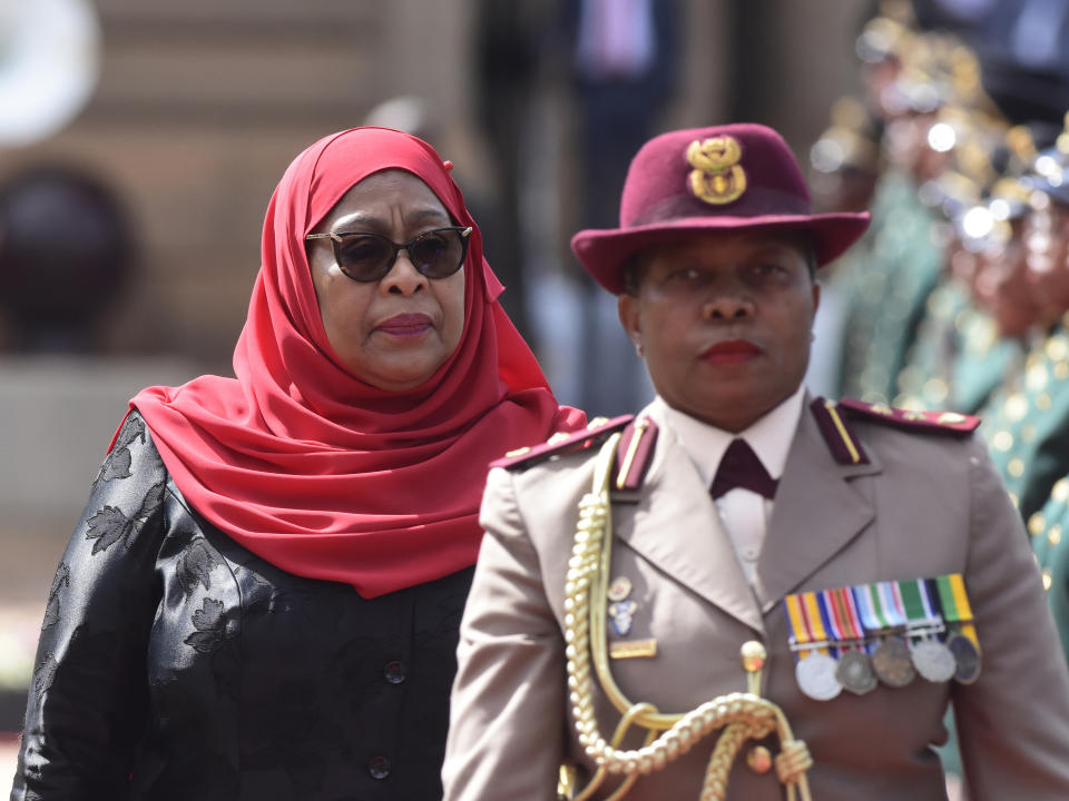 Tanzanian President Samia Suluhu Hassan inspects a guard of honour at a welcoming ceremony in Pretoria, South Africa, Thursday, March 16, 2023. Hassan, on a state visit to the country, has urged more security cooperation and trade between the two countries.(AP Photo/Frans Sello waga Machate)