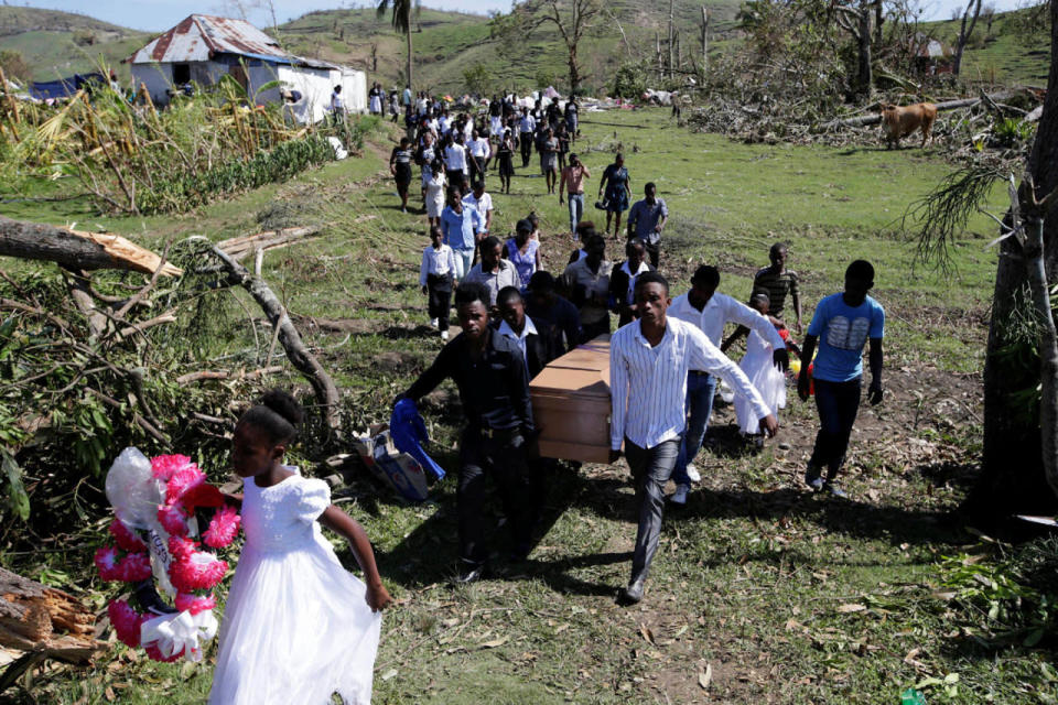 <p>Friends and relatives attend the funeral of Anne Dit Trozitha Zamore, who died during Hurricane Matthew, in Chantal, Haiti, October 8, 2016. (REUTERS/Andres Martinez Casares)</p>
