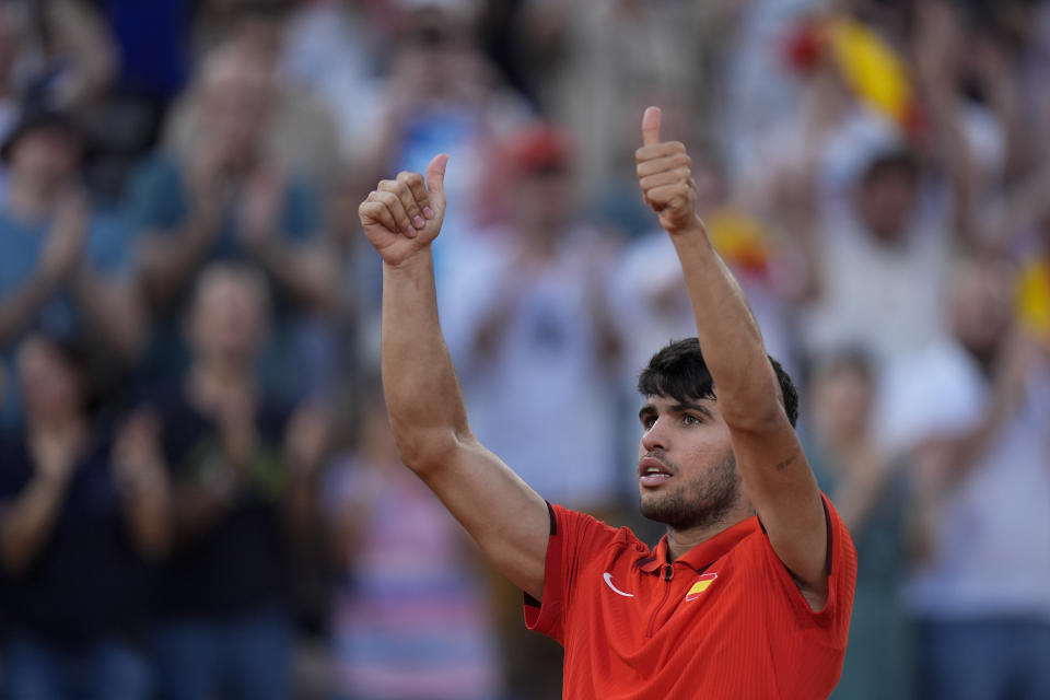 Carlos Alcaraz of Spain celebrates after defeating Tallon Griekspoor of the Netherlands in their men's singles second round match, at the 2024 Summer Olympics, Monday, July 29, 2024, at the Roland Garros stadium in Paris, France. (AP Photo/Andy Wong)