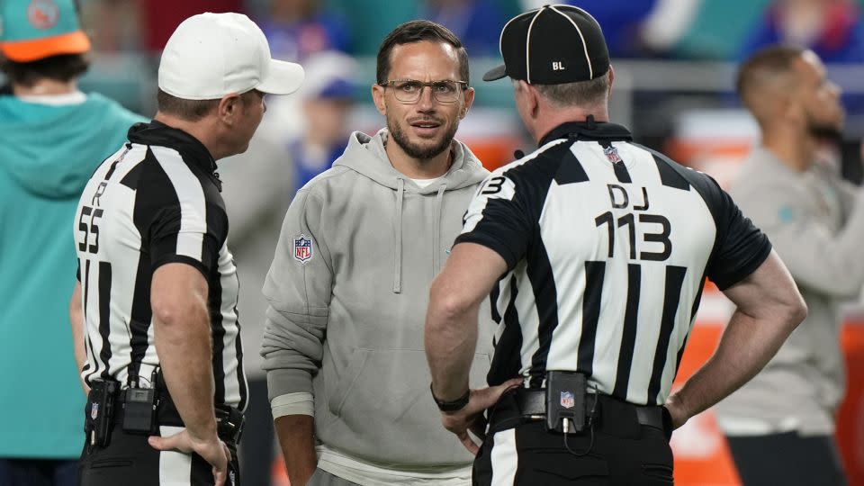 McDaniel talks to officials before the game against the Bills. - Wilfredo Lee/AP