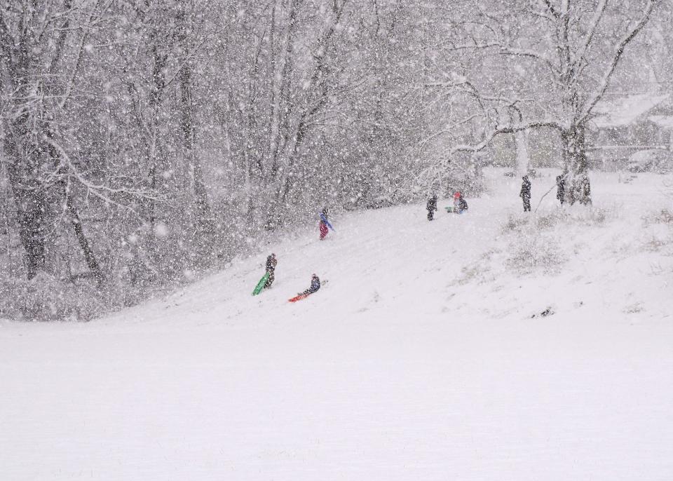 With all school districts in Lenawee County cancelling school for the day Wednesday because of a winter storm, children could spend some time playing in the snow and sledding down some of the hills at Island Park in Adrian.