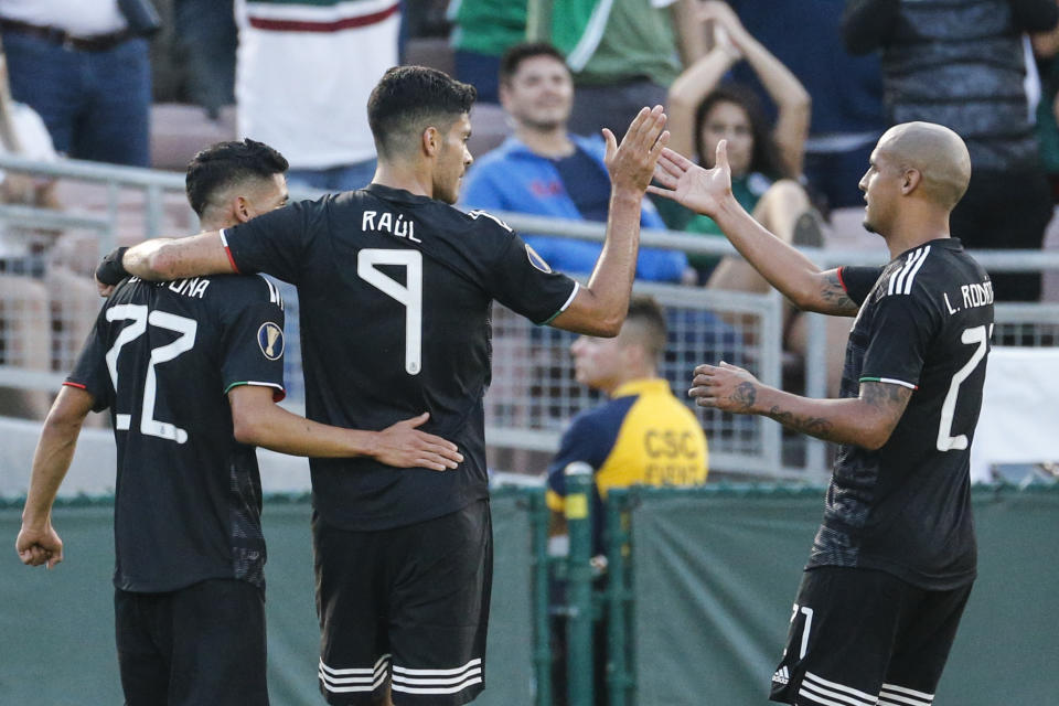 CORRECT TO URIEL ANTUNA, INSTEAD OF JORGE SANCHEZ - Mexico forward Raul Jimenez (9) celebrates his goal with Uriel Antuna (22) and Luis Rodriguez (21) during the first half of a CONCACAF Gold Cup soccer match against Cuba in Pasadena, Calif., Saturday, June 15, 2019. (AP Photo/Ringo H.W. Chiu)