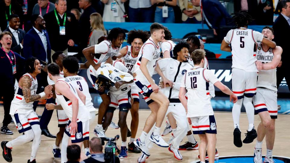 The Connecticut Huskies celebrate after beating the Purdue Boilermakers 75-60 to win the NCAA Men's Basketball Tournament National Championship game at State Farm Stadium on April 08, 2024 in Glendale, Arizona. (Photo by Chris Coduto/Getty Images) (Chris Coduto/Getty Images)