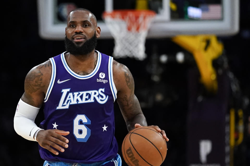 FILE - Los Angeles Lakers forward LeBron James (6) controls the ball during an NBA basketball game against the New Orleans Pelicans in Los Angeles, Friday, April 1, 2022. The NBA schedule comes out Wednesday afternoon, Aug. 17, 2022, and it'll provide the first look at, among other things, when LeBron James might pass Kareem Abdul-Jabbar as the NBA's all-time scoring leader. (AP Photo/Ashley Landis, File)