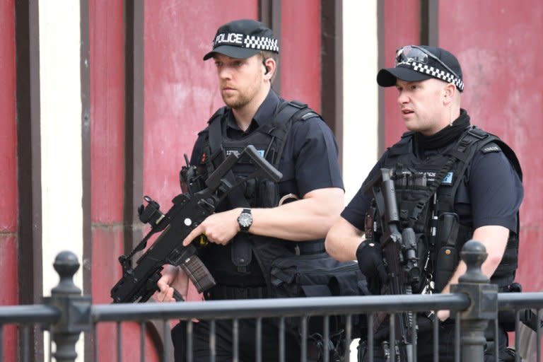 Armed police patrol near Manchester Arena on May 23, 2017 following a terror attack the previous evening