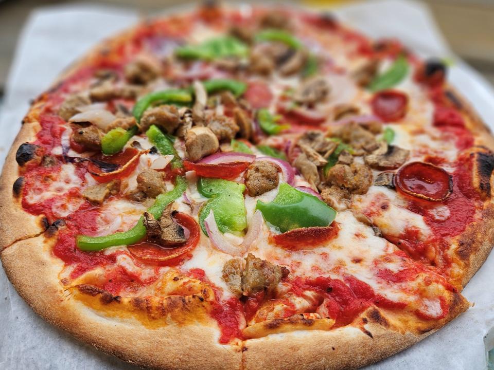 Anna Maria Island’s Pizza Social serves a signature pizza with red sauce, Italian sausage, pepperoni, mushrooms, red onion, bell pepper, and mozzarella. It was photographed Jan. 22, 2024.