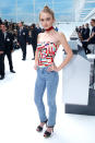<p>The 16-year-old daughter of actor Johnny Depp and French singer Vanessa Paradis looked youthful and age appropriate in printed tube top and jeans at Chanel’s airline-themed Spring 2016 show in Paris. <i>Photo: Getty Images</i></p>