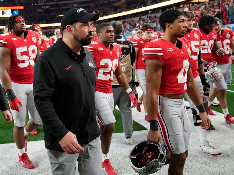 Dec 29, 2023; Arlington, Texas, USA; Ohio State Buckeyes head coach Ryan Day walks off the field after losing 14-3 to Missouri Tigers in the Goodyear Cotton Bowl Classic at AT&T Stadium.