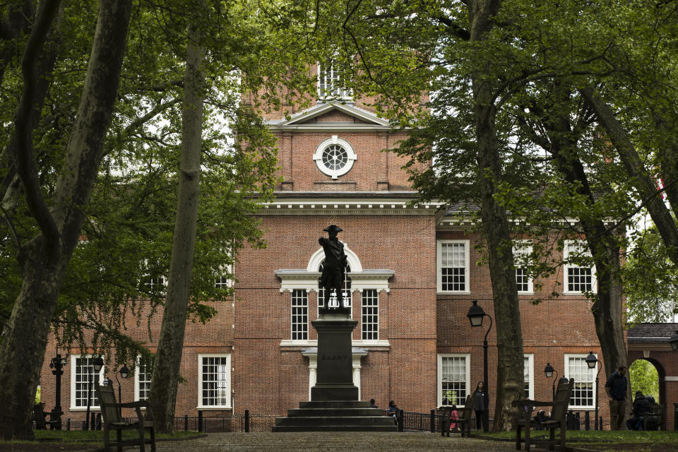 FILE - The exterior of Independence Hall appears in Philadelphia, on April 26, 2019. The location is featured in a collection of mini-essays by American writers published online by the Frommer's guidebook company about places they believe helped shape and define America. (AP Photo/Matt Rourke, File)