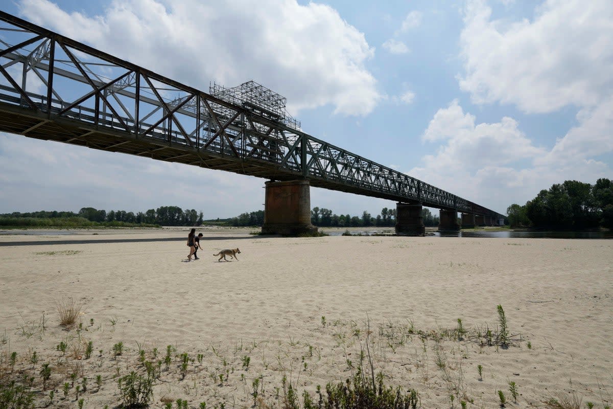 A view of the Po riverbed under Ponte della Becca shows the effects of the drought (AP)
