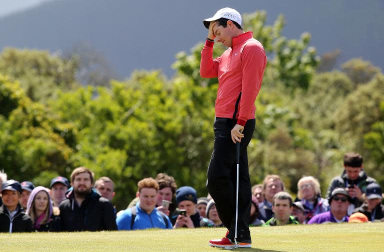 Rory McIlroy reacts after missing a putt on the 9th green on the first day of the Irish Open in Newcastle, Northern Ireland on May 28, 2015