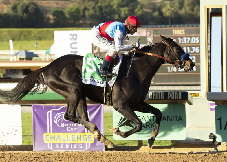 Medina Spirit and jockey John Velazquez win the Grade I $300,000 Awesome Again Stakes on Oct. 2, 2021 at Santa Anita.