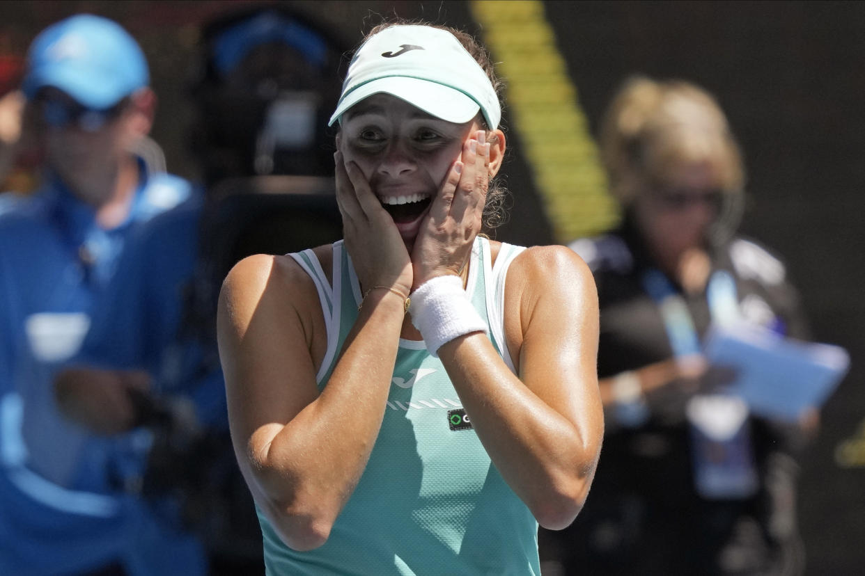 Magda Linette of Poland celebrates after defeating Karolina Pliskova of the Czech Republic in their quarterfinal match at the Australian Open tennis championship in Melbourne, Australia, Wednesday, Jan. 25, 2023. (AP Photo/Dita Alangkara)