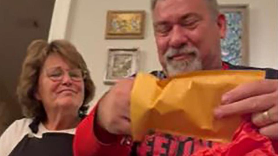 PHOTO: Lindsey Moore surprised her dad with a rookie Dan Marino football card, a collector's item that he sold over 30 years ago. (Lindsey Moore via Storyful)