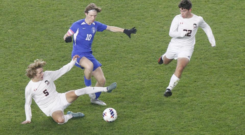 Lima Shawnee's Luca Fusillo, left, and Ethan Parlapiano battle Bexley's James McCann for the ball during the Division II state final at Lower.com Field on Nov. 12. Bexley lost in a shootout.