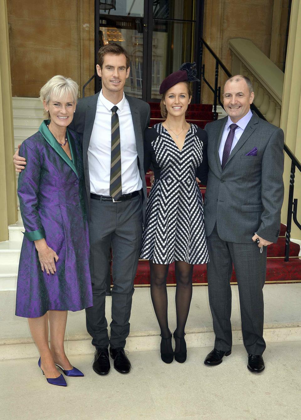 Wimbledon champion Andy Murray poses with his girlfriend Kim Sears and parents Judy and Will as they arrive at Buckingham Palace in London