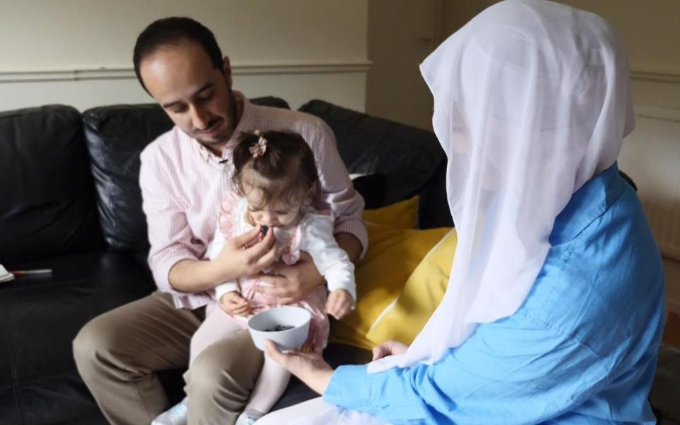 Massah pictured with her father and mother