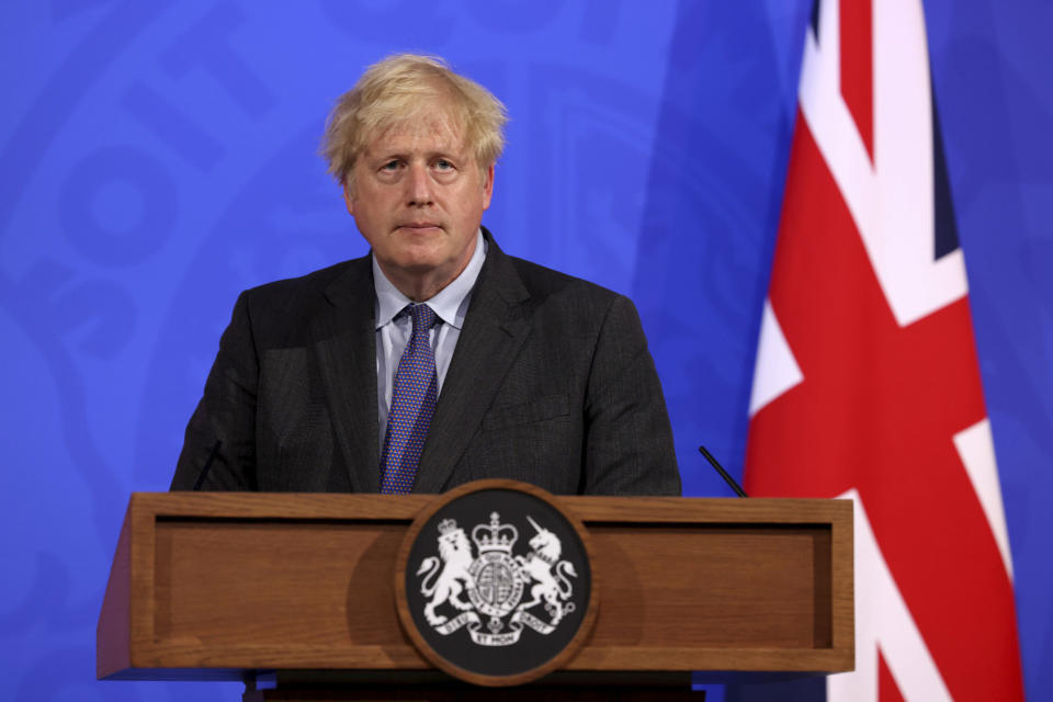 Britain's Prime Minister Boris Johnson attends a media briefing in Downing Street, London, Monday, June 14, 2021. Johnson has confirmed that the next planned relaxation of coronavirus restrictions in England will be delayed by four weeks until July 19 as a result of the spread of the delta variant. In a press briefing Monday, Johnson said he is “confident that we won’t need more than four weeks” as millions more people get fully vaccinated against the virus, which could save thousands of lives. (Jonathan Buckmaster/Pool Photo via AP)