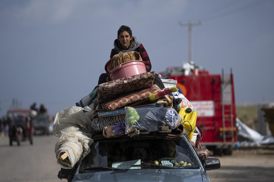 Palestinians arrive in the southern Gaza town of Rafah after fleeing an Israeli ground and air offensive in the nearby city of Khan Younis on Wednesday, Jan. 24, 2024. Israel has expanded its offensive in Khan Younis, saying the city is a stronghold of the Hamas militant group. (AP Photo/Fatima Shbair)