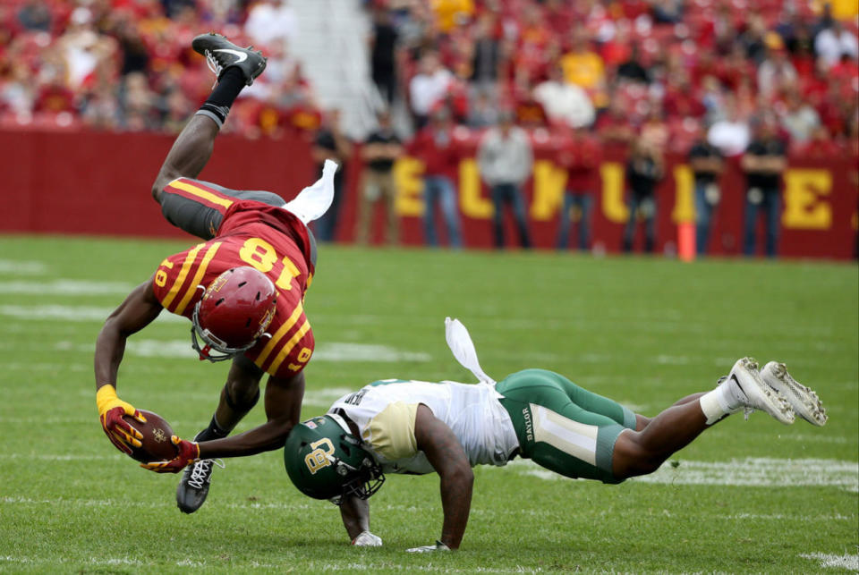 <p>Iowa State wide receiver Hakeem Butler is upended by Baylor linebacker Thomas Cletcher after catching a pass during the first half of an NCAA college football game, Oct. 1, 2016, in Ames, Iowa. (Photo: Justin Hayworth/AP)</p>