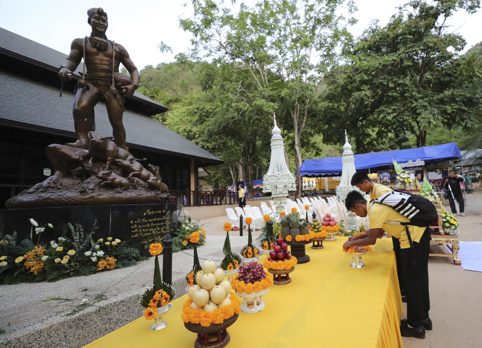 Members of the Wild Boars soccer team who were rescued from a flooded cave, pray in front of the statue of Saman Gunan, the retired Thai SEAL diver who died during the rescue mission, near the Tham Luang cave in Mae Sai, Chiang Rai province, Thailand Monday, June 24, 2019. The 12 boys and their coach attended a Buddhist merit-making ceremony at the Tham Luang to commemorate the one-year anniversary of their ordeal that saw them trapped in a flooded cave for more than two weeks. (AP Photo/Sakchai Lalit)