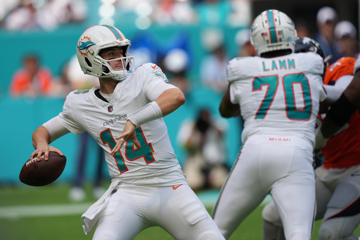 Miami Dolphins quarterback Mike White (14) drops back to pass against the Denver Broncos during the fourth quarter of an NFL game at Hard Rock Stadium in Miami Gardens, Sept. 24, 2023.