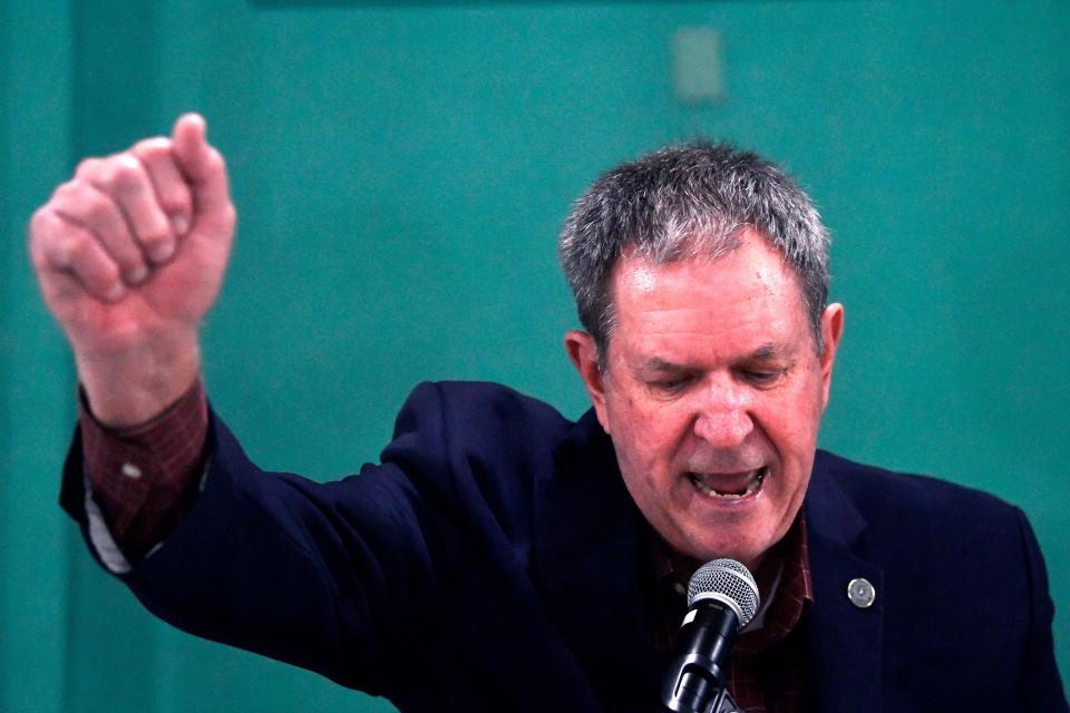 District 71 state Rep. Stan Lambert raises a fist as he promises supporters to keep fighting during his campaign rally at the Grace Museum Tuesday.