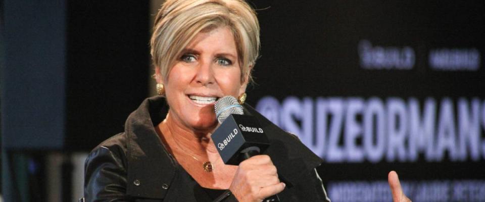 Suze Orman talks into microphone