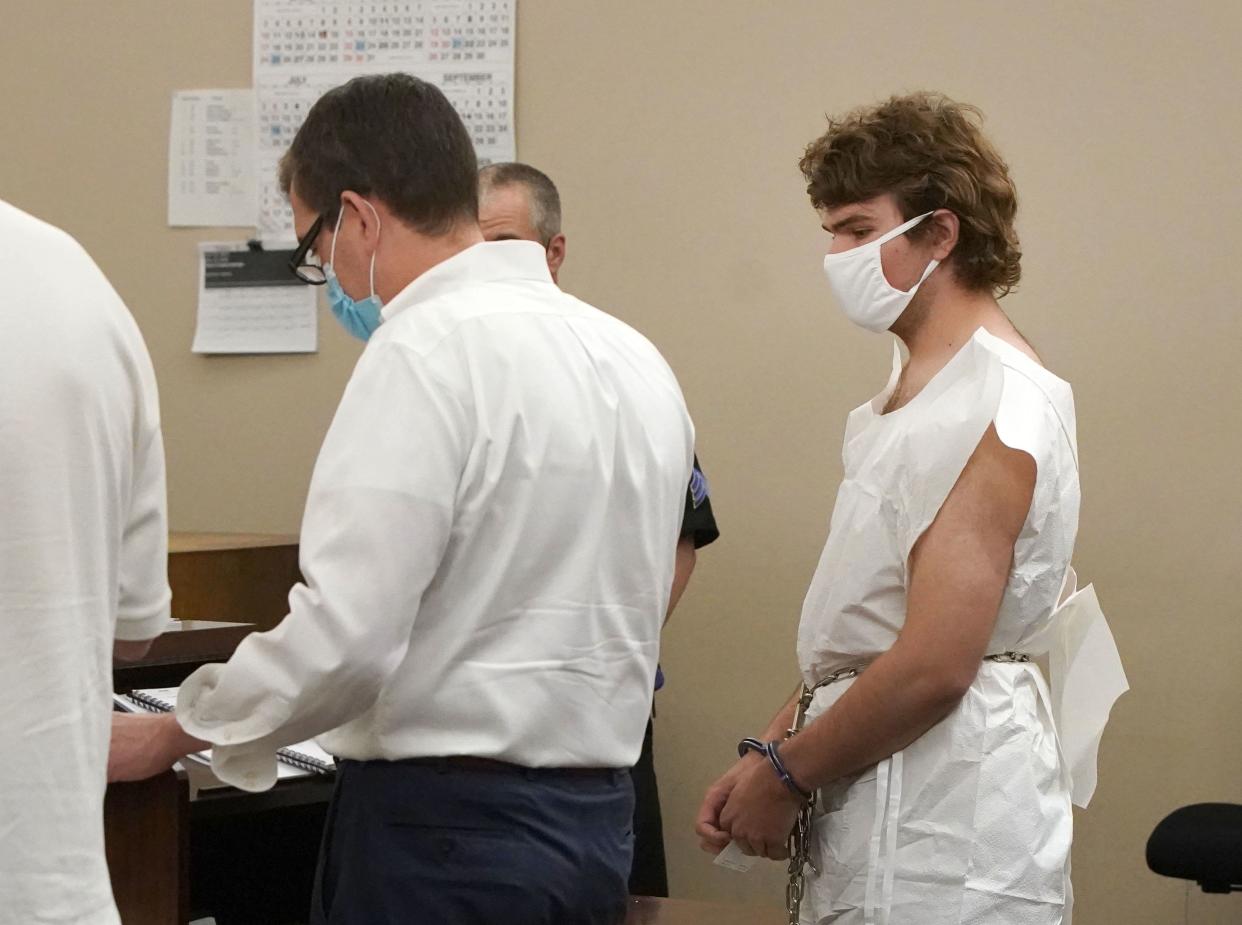 Payton Gendron talks with his attorney during his arraignment in Buffalo City Court, Saturday, May 14, 2022, in Buffalo, N.Y. 