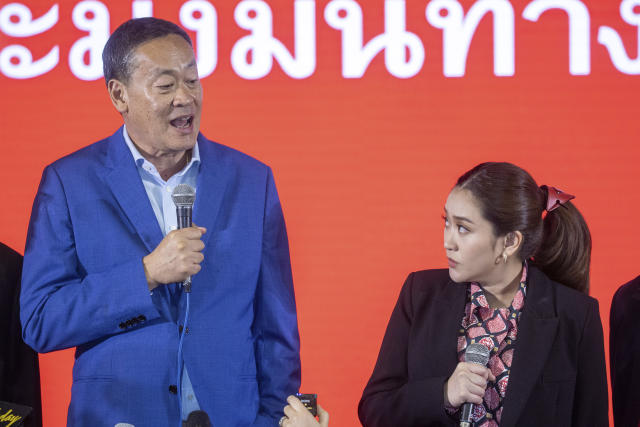 Pheu Thai Party's prime ministerial candidates Srettha Thavisin, left, and Paetongtarn Shinawatra, talks to reporter during a press conference at Pheu Thai headquarter in Bangkok, Thailand, Sunday, May 14, 2023. Thailand's main opposition party took an early lead in a vote count from Sunday's general election, touted as a pivotal chance for change nine years after incumbent Prime Minister Prayuth Chan-ocha first came to power in a 2014 coup. (AP Photo/Wason Wanichakorn)