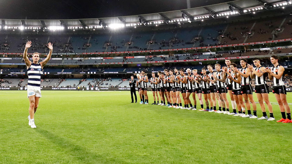 Joel Selwood, pictured here getting a guard of honour from Collingwood players after breaking the AFL record for most games as captain.