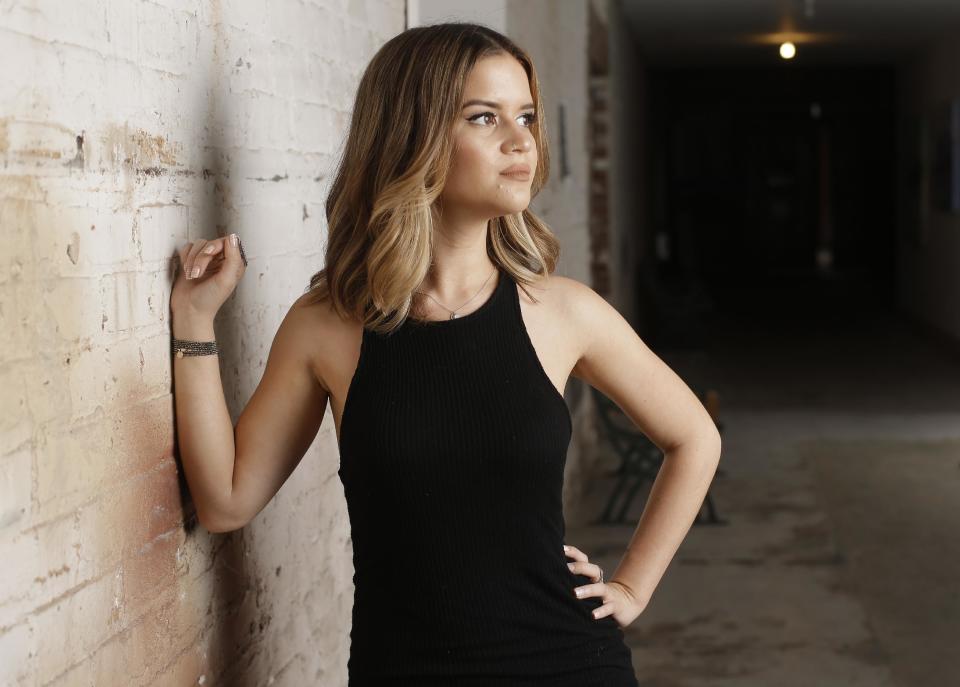 In this May 31, 2016, photo, Maren Morris poses in Nashville, Tenn. Morris is nominated for a Grammy Award for best new artist. The 59th annual Grammy Awards will air live on CBS, Sunday, Feb. 12, from the Staples Center in Los Angeles. (AP Photo/Mark Humphrey)