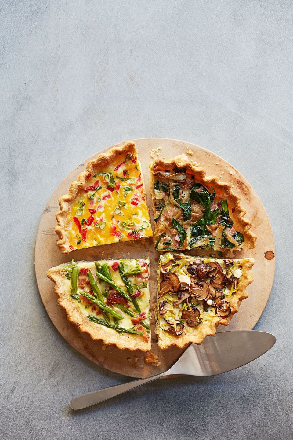 <p>Make your guests feel like they're at an upscale restaurant with this quiche, jazzed up with colorful fresh veggies.</p><p><em><a href="https://www.womansday.com/food-recipes/food-drinks/recipes/a39910/ham-spinach-make-ahead-quiche-recipe-ghk0514/" rel="nofollow noopener" target="_blank" data-ylk="slk:Get the recipe for Ham and Spinach Make-Ahead Quiche.;elm:context_link;itc:0;sec:content-canvas" class="link ">Get the recipe for Ham and Spinach Make-Ahead Quiche.</a> </em></p>