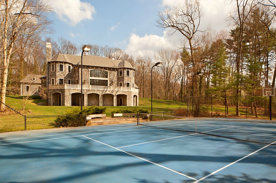 The home sits on 4.4 acres in Saddle River, New Jersey. The tennis court is lighted.